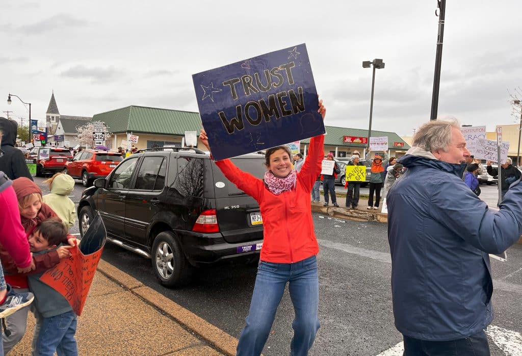 Erin Trust Women sign - Bucks County Beacon - Photo Essay: ‘Hands Off’ Quakertown Rally Draws 1,000 Protesters