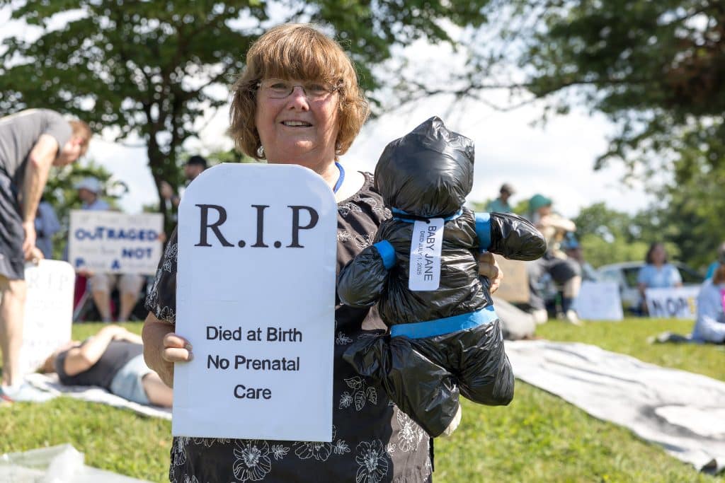 Indivisible DIE IN 4 - Bucks County Beacon - PHOTO ESSAY: Hundreds Participate in Die-in at Congressman Brian Fitzpatrick’s Office to Highlight Deadly Stakes of GOP Budget