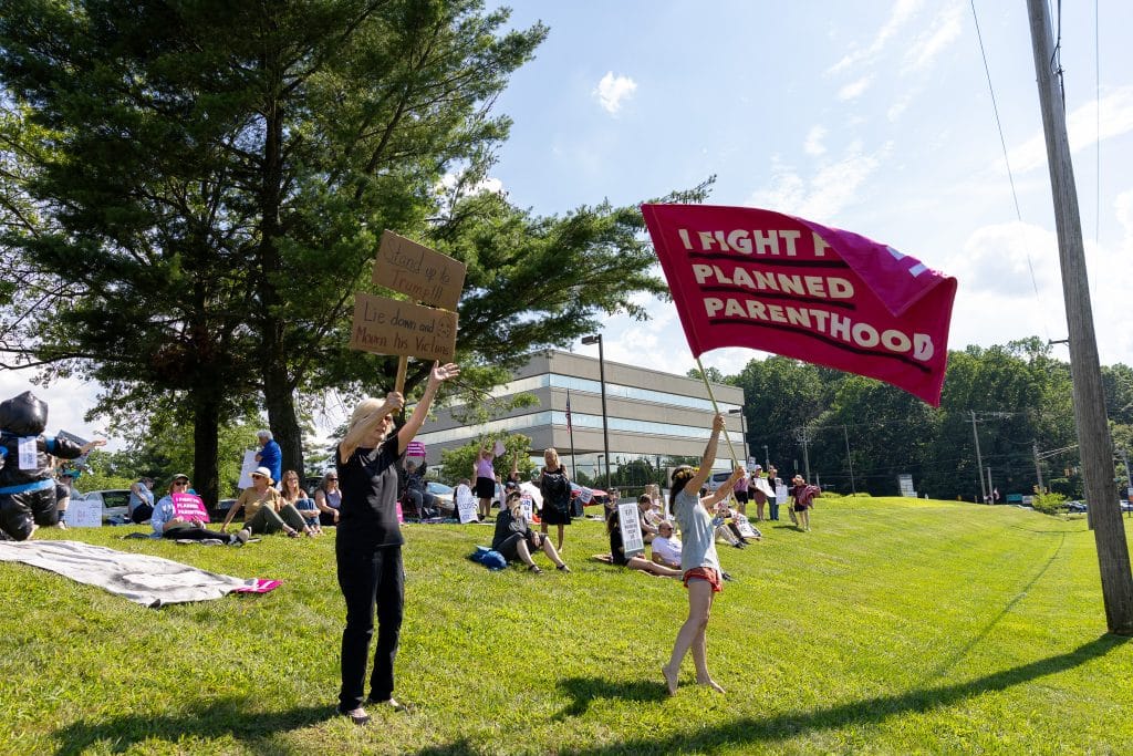 Indivisible DIE IN FITZ 5 - Bucks County Beacon - PHOTO ESSAY: Hundreds Participate in Die-in at Congressman Brian Fitzpatrick’s Office to Highlight Deadly Stakes of GOP Budget
