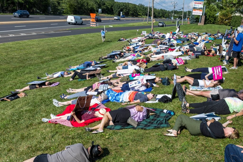 Indivisible Die In 13 - Bucks County Beacon - PHOTO ESSAY: Hundreds Participate in Die-in at Congressman Brian Fitzpatrick’s Office to Highlight Deadly Stakes of GOP Budget
