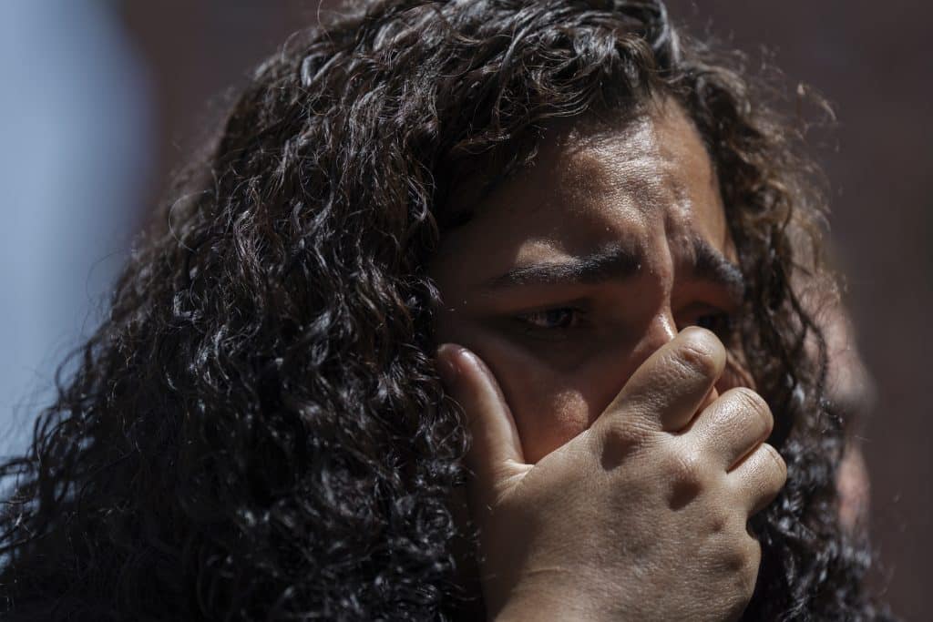 Immigrant woman crying - Bucks County Beacon - The Brutality Is the Message: The Trump Administration and ICE's Violence Against Immigrants and Their Advocates